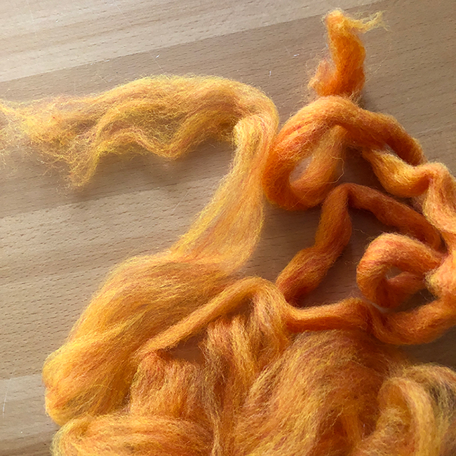 Image of Original roving with pre drafted fiber ready to spin