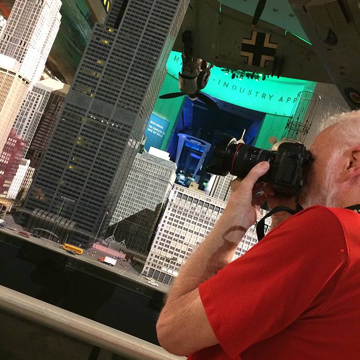 Image of Bob Emmott photographing at Museum of Science and Industry